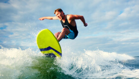 Surfer Riding Wave
